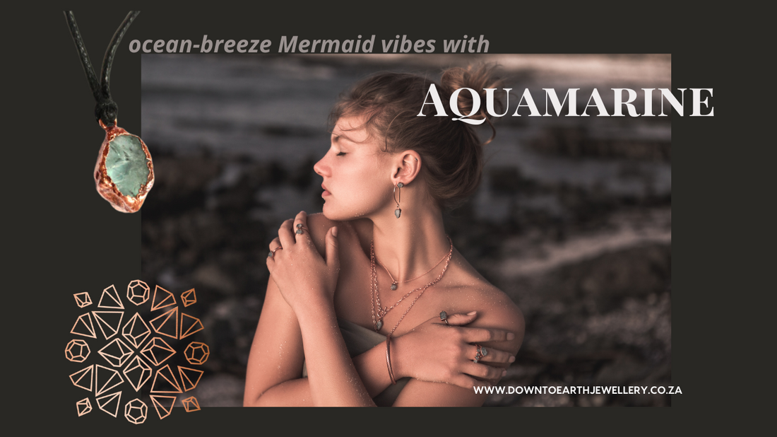 model on beach wearing copper and aquamarine jewellery