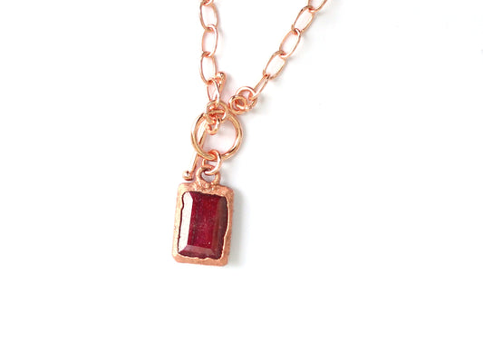 Rectangular Ruby pendant on oval link chain